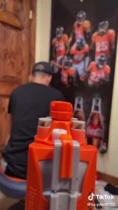 Mean kid shoot friend in back with a pointy nerf dart.