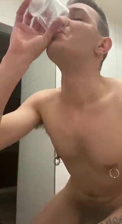 Cute bottom drinks a fresh glass of cum from his ass