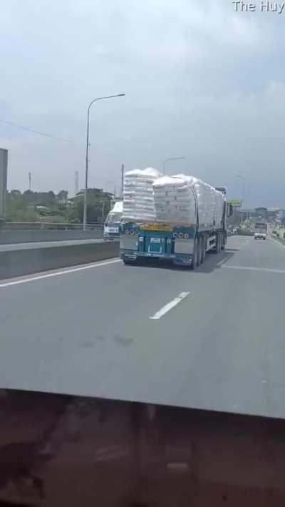 Packages Slip Off Truck And Spill Onto Roadway