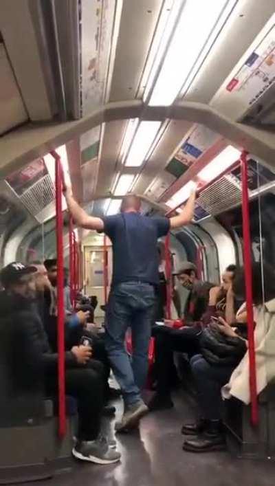 Racist scumbag threatens an Asian girl on the subway, until the other passengers intervene