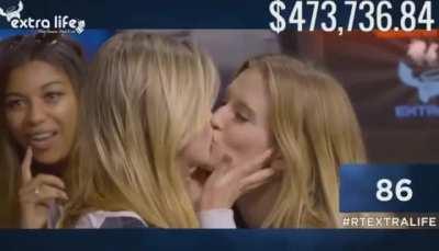 Barbara Dunkelman and Ashley Jenkins sharing a kiss