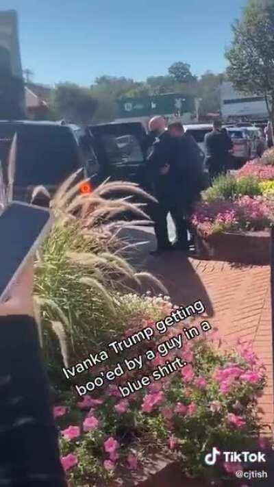 Ivanka Trump being loudly booed by a man in a blue shirt