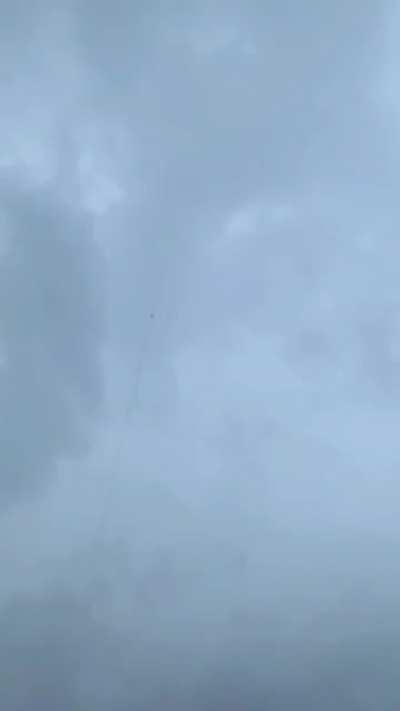 Lightning bolt is guided to ground through rocket trail