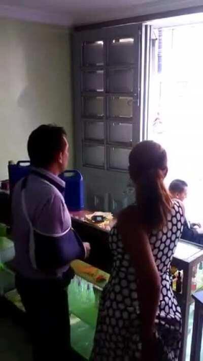 Stealth blowjob behind transparent glass.