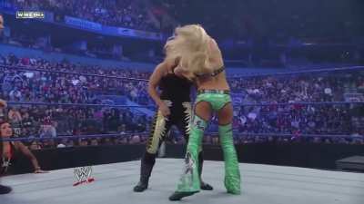 Kelly Kelly delivering forearm shots to Natalya