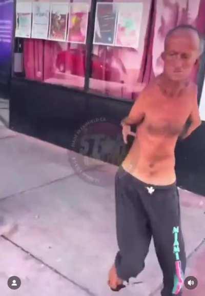 Disabled man, armed with foot scissors, chases after a man who was harassing him.