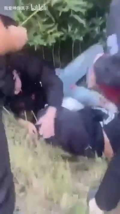 Doing stunts on a scooter... not a single helmet to be found (China)