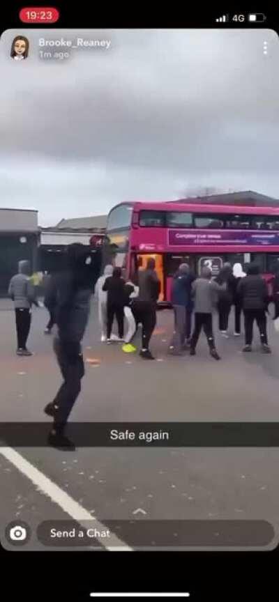 Savages petrol bomb a bus with the driver still in it.