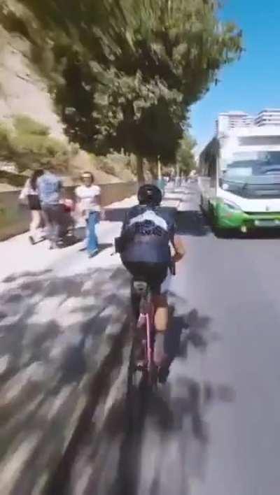 Jackass rides bike against traffic 