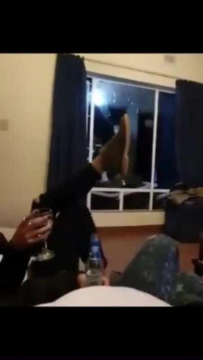 Jumping through a window at a party
