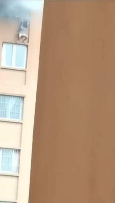 Girl Fell From A Window Of A Burning Building In China