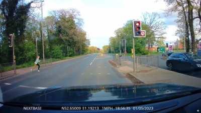 Kid trying to cross the road, thinking both lights were red