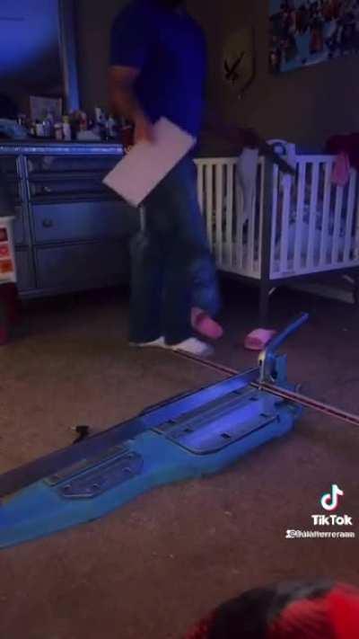 Guy comes home excited when gifted a tile cuter.