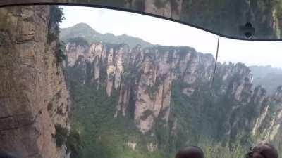 The Bailong Elevator is a glass double-deck elevator built onto the side of a huge cliff in the Wulingyuan area of Zhangjiajie, People's Republic of China that is 326 m (1,070 ft) high