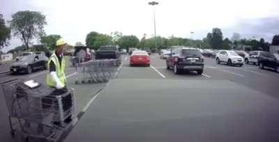 Worker tries to collect shopping carts and fails miserably