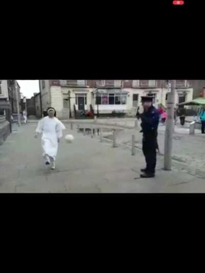 Irish Garda playing football with a Dominican sister