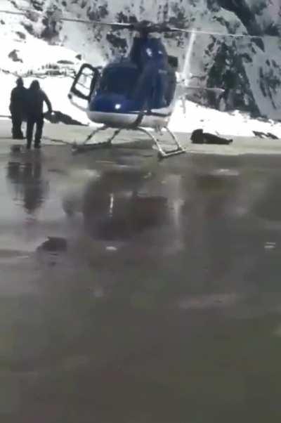 Trying to take a selfie near a helicopter, what could go wrong?