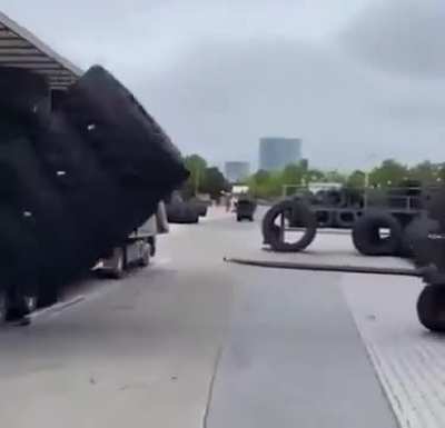 This forklift collaborator aiding large tires!