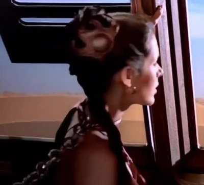 Slave Leia Glares Back At Jabba As He Pulls On Her Chain