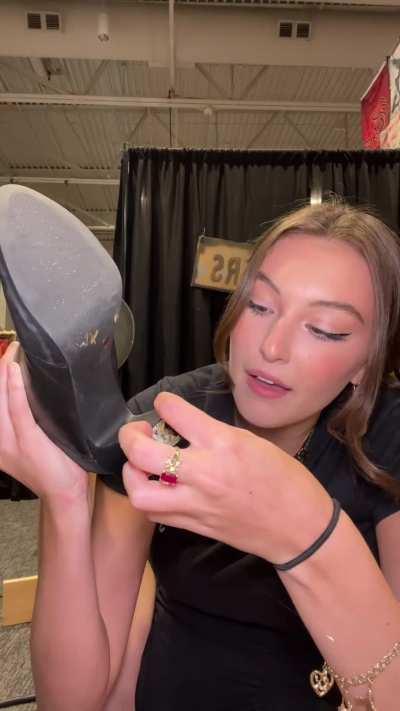 Gluing her heal back on 