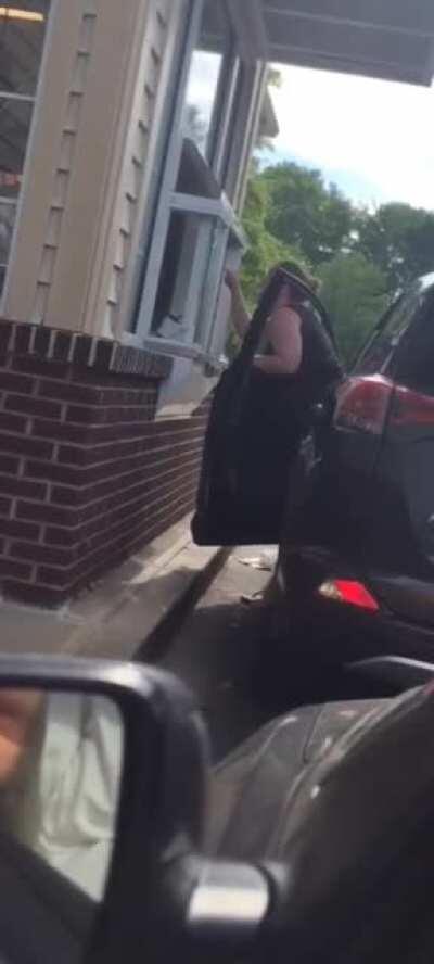 Woman mad at a Dunkin' Donuts Gets a Face Full of Iced Coffee and Banshee Screams.