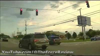 Woman tries to run over a bunch of people and breaks her car and flees police.