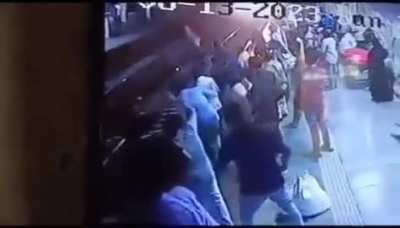 Indian man is smacked onto the tracks after grabbing a woman and is hit by the oncoming train