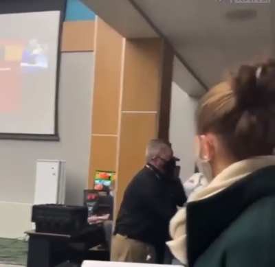 Maskless parent got dragged out of an education committee meeting.