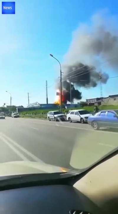 Road view of fuel tank explosion at a gas station...