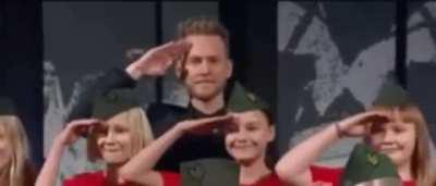 Realizing that it is a wrong place to do this salute