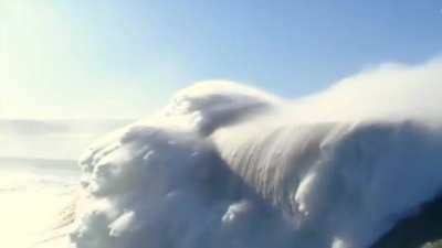 surfing this enormous wave