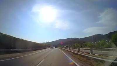 Car flies into Japanese Tour bus