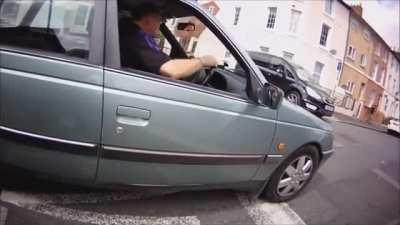 Angry driver chases after the person who took video of his reckless driving, and gets what he deserves