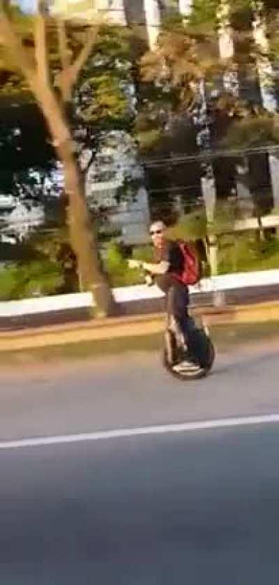 Idiot on unicycle?…Segway?….Idiot on the highway.
