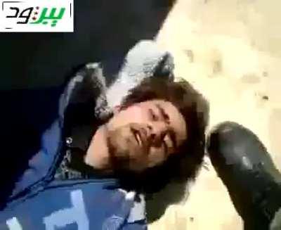 Syrian army regime soldier shoots a protester and beats him. 2011 Syria. NSFW!