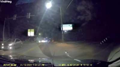 Car is flipped on its side after being hit