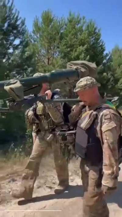 Soldiers grumbling, giving an example of why a car is useful at the front.