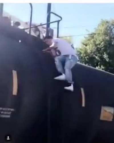 Jumping from one freight car to another.