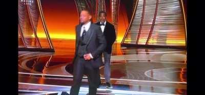 Will smith punches Chris rock after the latter jokes about his wife’s hair