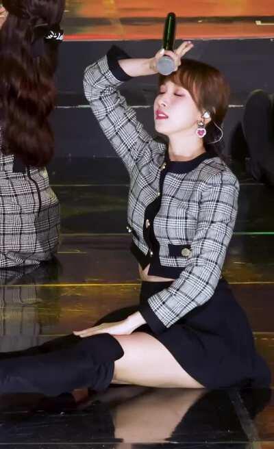 Mina - ponytail, black knee-high boots, skirt, b&w jacket