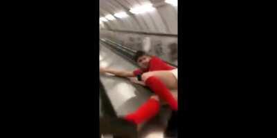 Going down the middle part of the escalators