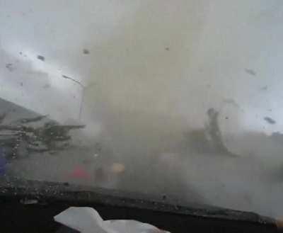 White car cuts off driver and gets swallowed by a tornado