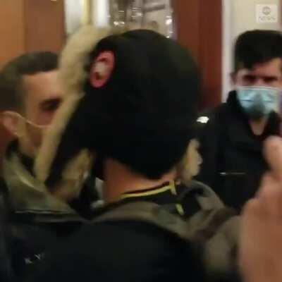 New video shows members of Congress inside the Capitol as a pro-Trump mob pushed against a barricaded door on Wednesday, with one rioter punching and breaking the glass