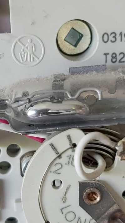 My thermostat uses an expanding metal coil to tilt a glass vial full of mercury which conducts two metal contacts