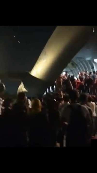 Afghans desperately climbing into C17 earlier today