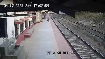 A railway worker in India saves a blind woman's kid from a train.