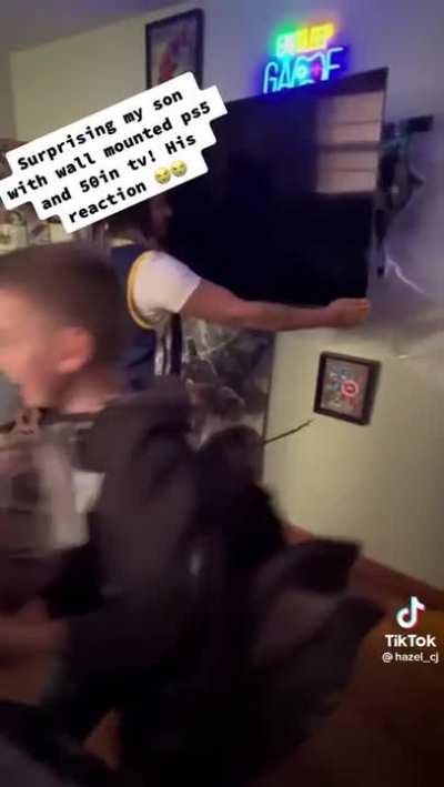 Son has the most wholesome reaction to his dad getting him a PS5