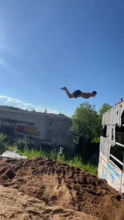Triple backflip off tube into sand