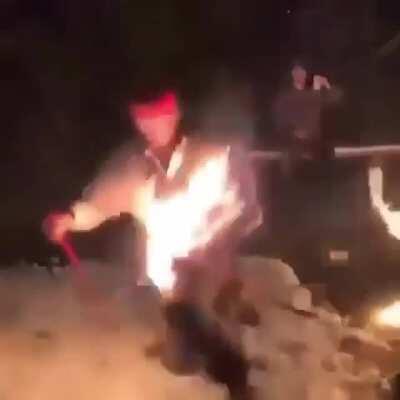 skiing over a rail on fire