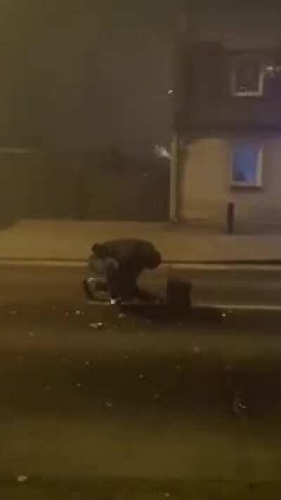 Lighting fireworks in the road.